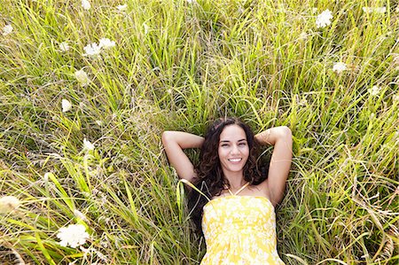 Woman in field of wildflowers Stock Photo - Premium Royalty-Free, Code: 614-07805854