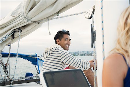 simsearch:614-07805999,k - Young man on sailing boat, laughing Foto de stock - Sin royalties Premium, Código: 614-07806006