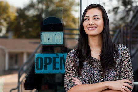 store outdoors - Portrait of sales assistant outside shop window Stock Photo - Premium Royalty-Free, Code: 614-07806416