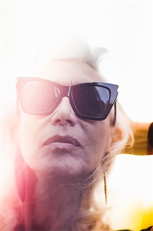 Hip senior woman wearing sunglasses Stock Photo - Premium Royalty-Free, Code: 614-07806431