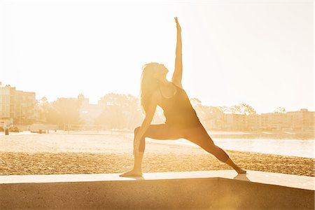 simsearch:614-06402798,k - Young woman doing yoga on pier at Pacific beach at sunset, San Diego, California, USA Stock Photo - Premium Royalty-Free, Code: 614-07806507