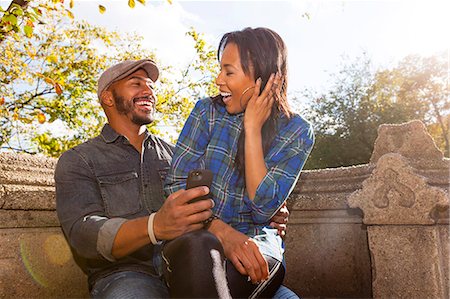 sitting on lap facing each other - Happy couple, Central Park, New York, USA Stock Photo - Premium Royalty-Free, Code: 614-07911879