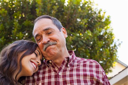 portrait happy latin family - Father and daughter sharing tender moment Stock Photo - Premium Royalty-Free, Code: 614-08000142