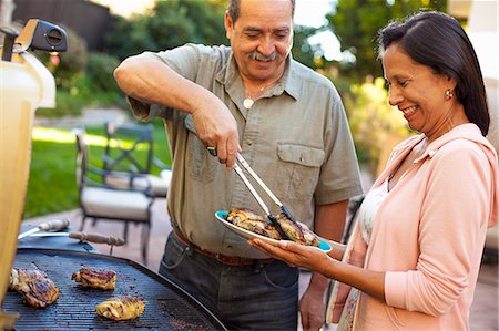 simsearch:649-07520163,k - Husband and wife at barbecue grill in garden Stock Photo - Premium Royalty-Free, Code: 614-08000157