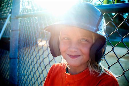 Portrait of young girl wearing baseball kit Fotografie stock - Premium Royalty-Free, Codice: 614-08000256