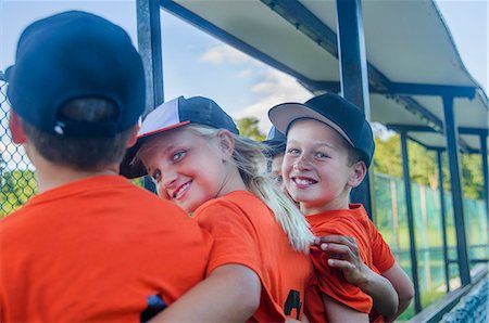 Young baseball players with arms around each other, rear view Stock Photo - Premium Royalty-Free, Code: 614-08000262