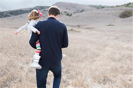 simsearch:649-07064057,k - Rear view of mature man carrying daughter whilst out walking Photographie de stock - Premium Libres de Droits, Code: 614-08030665