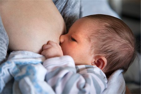 simsearch:400-08500664,k - Mother breastfeeding baby daughter Stock Photo - Premium Royalty-Free, Code: 614-08030780