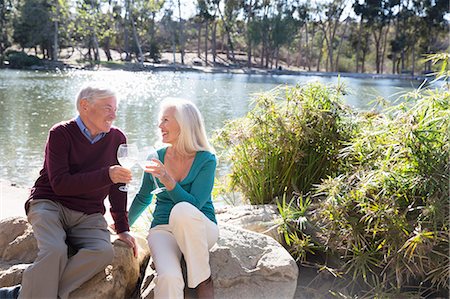 Husband and wife toasting by lake, Hahn Park, Los Angeles, California, USA Stock Photo - Premium Royalty-Free, Code: 614-08030820