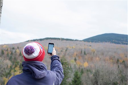 simsearch:614-08720980,k - Rear view of male hiker reading smartphone texts in landscape, Rangeley, Maine, USA Stock Photo - Premium Royalty-Free, Code: 614-08031080