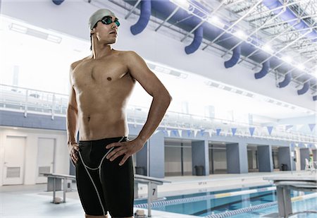 Male swimmer at swimming pool, looking away Stock Photo - Premium Royalty-Free, Code: 614-08031114