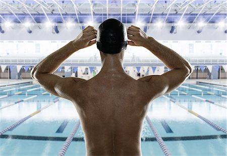 simsearch:614-08031116,k - Male swimmer preparing himself at edge of swimming pool Stock Photo - Premium Royalty-Free, Code: 614-08031116