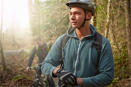 simsearch:6118-07354271,k - Two young men in forest, riding mountain bikes Stock Photo - Premium Royalty-Free, Code: 614-08065978