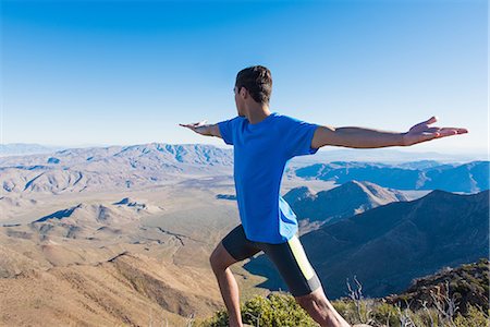 simsearch:614-08869222,k - Male trail runner warming up whilst looking out at landscape on Pacific Crest Trail, Pine Valley, California, USA Stock Photo - Premium Royalty-Free, Code: 614-08065992