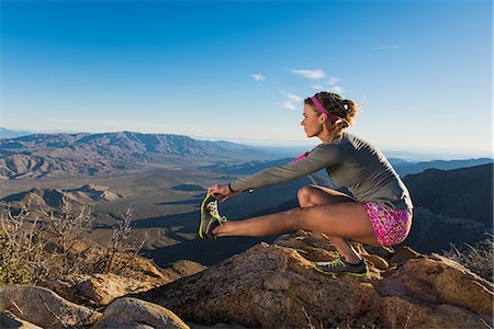 stretching outside - Rear view of young female trail runner crouching and touching toes,Pacific Crest Trail, Pine Valley, California, USA Stock Photo - Premium Royalty-Free, Code: 614-08066012
