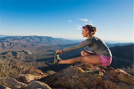 simsearch:649-08950376,k - Rear view of young female trail runner crouching and touching toes,Pacific Crest Trail, Pine Valley, California, USA Stock Photo - Premium Royalty-Free, Code: 614-08066012