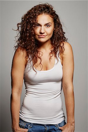 female portrait gray background - Portrait of woman in tank top Stock Photo - Premium Royalty-Free, Code: 614-08066114