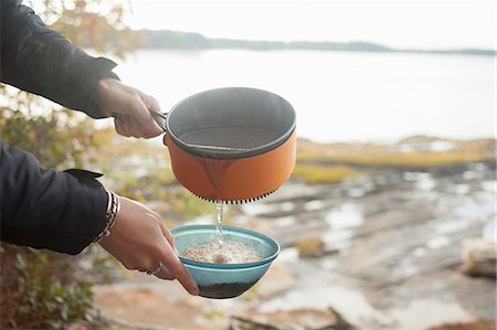 Preparing food at lakeside, Maine, USA Stock Photo - Premium Royalty-Free, Code: 614-08066162