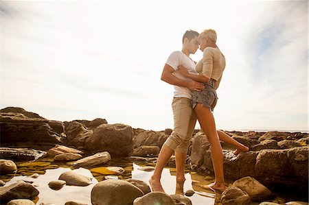 simsearch:614-08081310,k - Young couple standing together, face to face, in rock pool on beach Stock Photo - Premium Royalty-Free, Code: 614-08081303