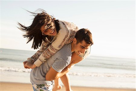 simsearch:614-08081310,k - Young couple fooling around on beach Stock Photo - Premium Royalty-Free, Code: 614-08081311