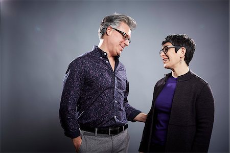 Studio portrait of mature couple face to face Photographie de stock - Premium Libres de Droits, Code: 614-08081355