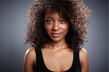 female portrait gray background - Studio portrait of beautiful young woman Stock Photo - Premium Royalty-Free, Code: 614-08081380