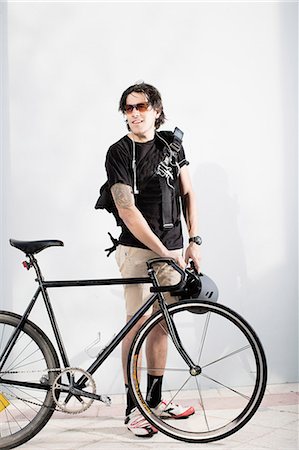 stand - Bike messenger with bike Stock Photo - Premium Royalty-Free, Code: 614-08081419