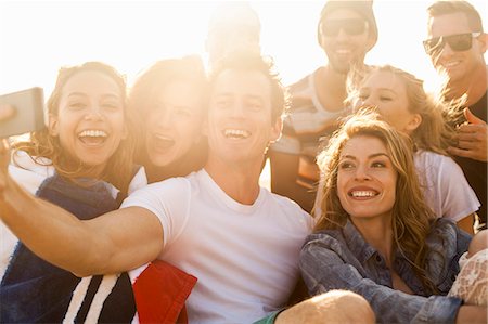 enjoying the beach - Group of friends taking selfie on beach Stock Photo - Premium Royalty-Free, Code: 614-08119587