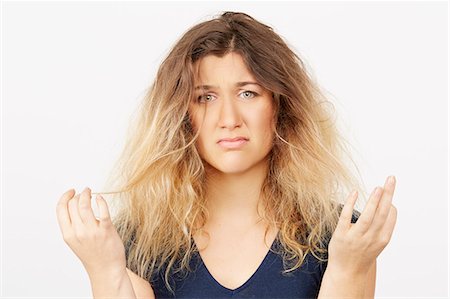 Young woman with damaged dyed hair Stock Photo - Premium Royalty-Free, Code: 614-08119637