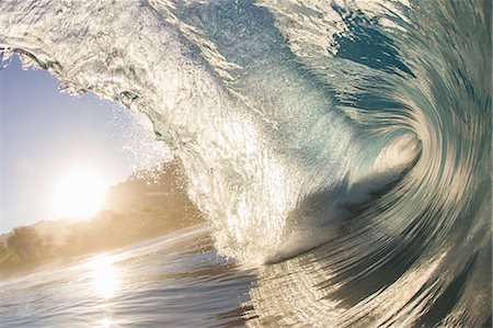 Barrelling wave at sunset, Hawaii Foto de stock - Sin royalties Premium, Código: 614-08119766