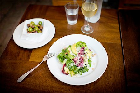 simsearch:614-08126643,k - Plate of avocado salad on restaurant table Stock Photo - Premium Royalty-Free, Code: 614-08126648