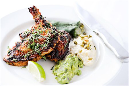 simsearch:614-08126643,k - Brick chicken - roasted chicken with stuffed pepper, guacamole and potatoes Stock Photo - Premium Royalty-Free, Code: 614-08126643