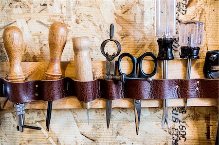 scissors and fabric - Row of hand tools on workshop wall Stock Photo - Premium Royalty-Free, Code: 614-08148268