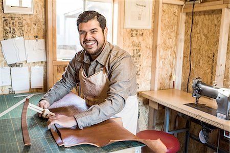 people at workshop - Portrait of leather craftsman at workshop bench Stock Photo - Premium Royalty-Free, Code: 614-08148274