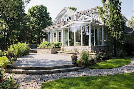 patio, not people - Brick and stone cottage style home with sunroom, patio and landscaped backyard, Quebec, Canada Photographie de stock - Premium Libres de Droits, Code: 614-08148366