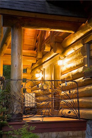 simsearch:614-08329341,k - Front porch and entrance door, cottage style log home illuminated at dusk, Quebec, Canada Stock Photo - Premium Royalty-Free, Code: 614-08148369