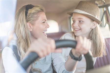 Mother and daughter in car together, smiling Stock Photo - Premium Royalty-Free, Code: 614-08148510