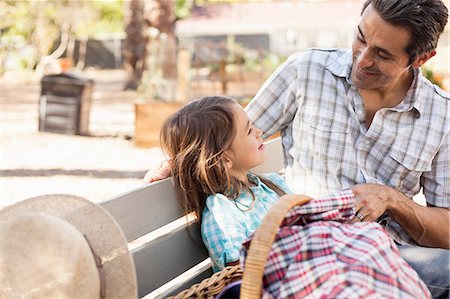 simsearch:614-08148597,k - Mid adult man talking with daughter on community garden bench Photographie de stock - Premium Libres de Droits, Code: 614-08148606