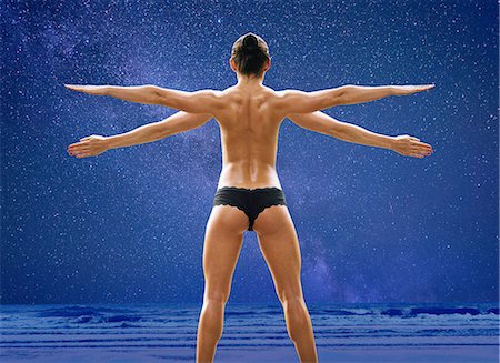 picture back muscles human body - Rear view composite of young woman with four arms wearing knickers in front of blue sky and seascape Stock Photo - Premium Royalty-Free, Code: 614-08148729