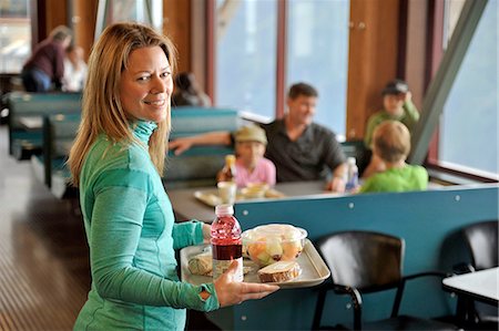 fast food restaurant - Family taking a break from hiking, Glacier Express Restaurant, Upper Tram Terminal, Alyeska Resort, Mt. Alyeska, Girdwood, Alaska, USA Stock Photo - Premium Royalty-Free, Code: 614-08202112