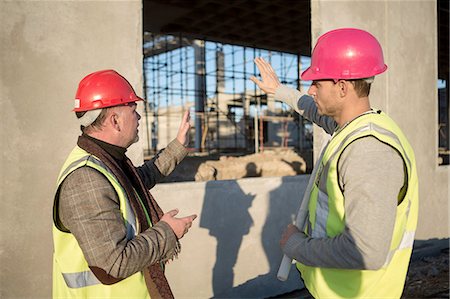 simsearch:614-06895837,k - Architect and builder discussing window frame on construction site Stock Photo - Premium Royalty-Free, Code: 614-08202132