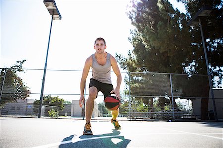 simsearch:649-07710284,k - Young male basketball player preparing to throw ball on basketball court Stock Photo - Premium Royalty-Free, Code: 614-08202332