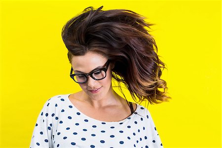 saturiert - Portrait of young woman flicking hair Photographie de stock - Premium Libres de Droits, Code: 614-08220180