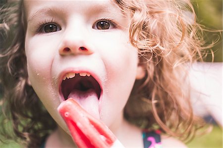eis am stiel - Close up of girl licking ice lolly Stockbilder - Premium RF Lizenzfrei, Bildnummer: 614-08270022