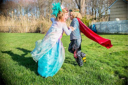 Children in costumes playing outdoors Stock Photo - Premium Royalty-Free, Code: 614-08270168