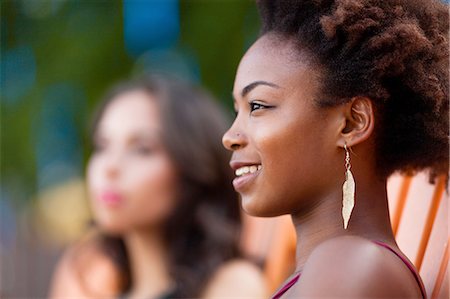 Young women relaxing on deck chair Stock Photo - Premium Royalty-Free, Code: 614-08270430