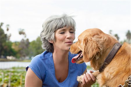simsearch:614-08926187,k - Mature woman petting dog, outdoors Stock Photo - Premium Royalty-Free, Code: 614-08307904