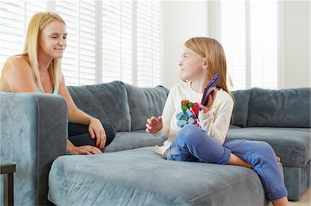 simsearch:614-06897570,k - Mother and daughter using digital tablet on sofa in living room Stock Photo - Premium Royalty-Free, Code: 614-08307989