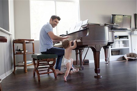 parents music - Father and baby boy playing on piano Stock Photo - Premium Royalty-Free, Code: 614-08308004