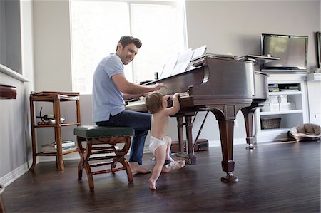 pianoforte - Father and baby boy playing on piano Fotografie stock - Premium Royalty-Free, Codice: 614-08308004